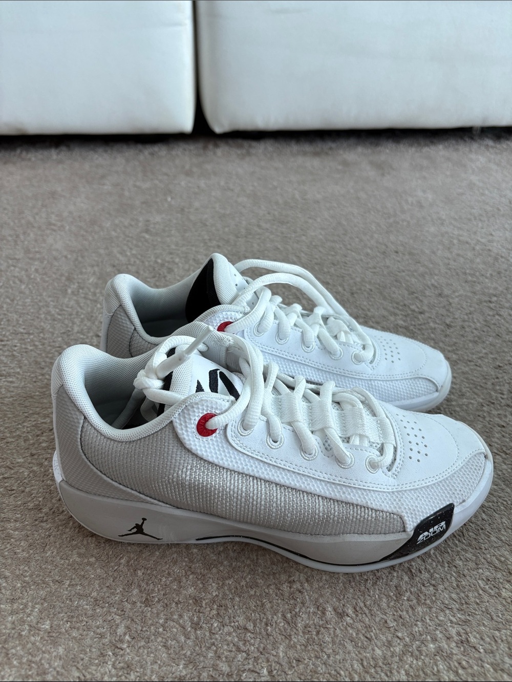 Like brand new Jordan Low-Top White Sneakers with Red Accent